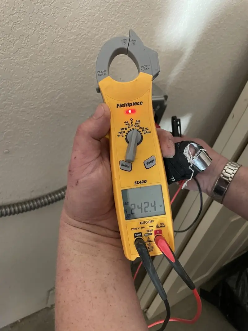 Voltage testing with clamp meter during Circuit Breaker Repair in West Pennsboro